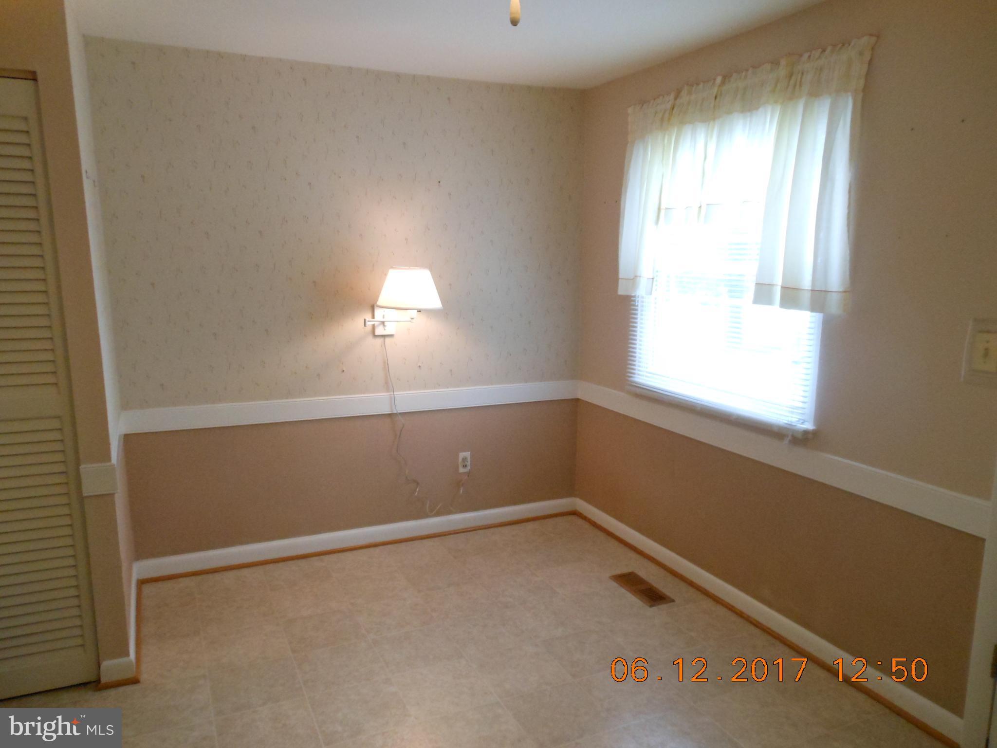 3704 Holly Grove Road Baltimore, MD 21220 - Photo 3 of 13 an empty room with a window