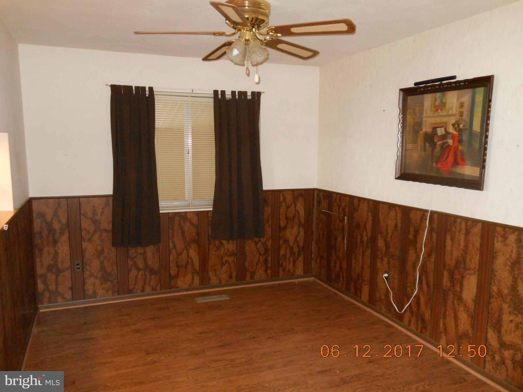 3704 Holly Grove Road Baltimore, MD 21220 - Photo 4 of 13 a view of a hallway with wooden floor
