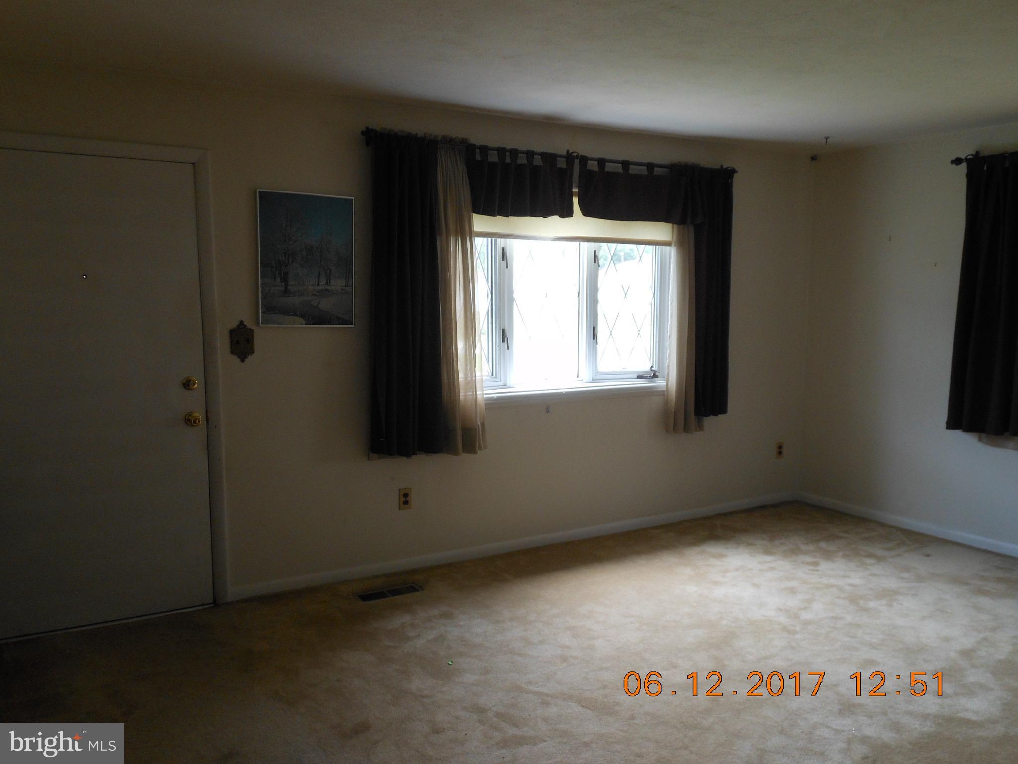 3704 Holly Grove Road Baltimore, MD 21220 - Photo 5 of 13 an empty room with a window