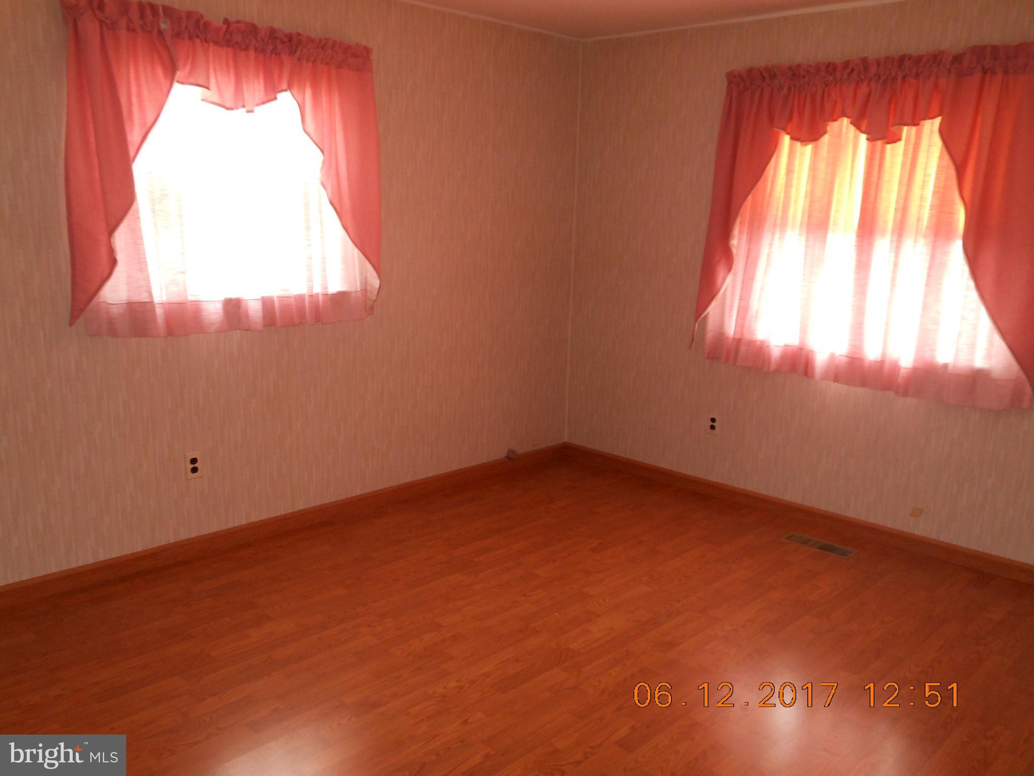 3704 Holly Grove Road Baltimore, MD 21220 - Photo 6 of 13 an empty room with a window