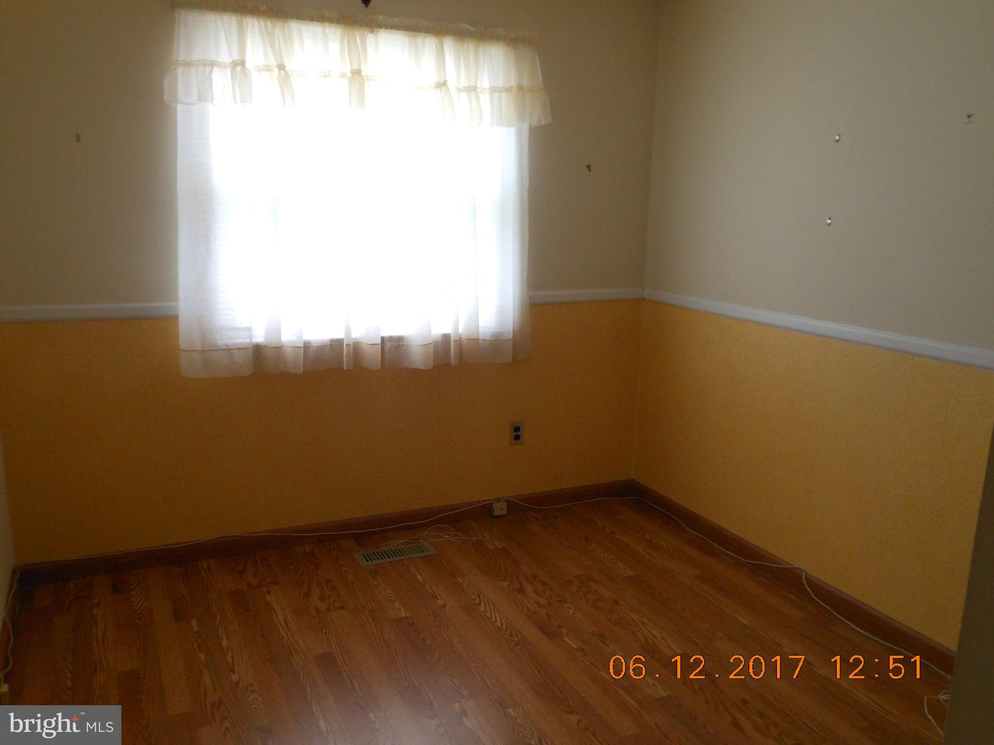 3704 Holly Grove Road Baltimore, MD 21220 - Photo 7 of 13 an empty room with a window