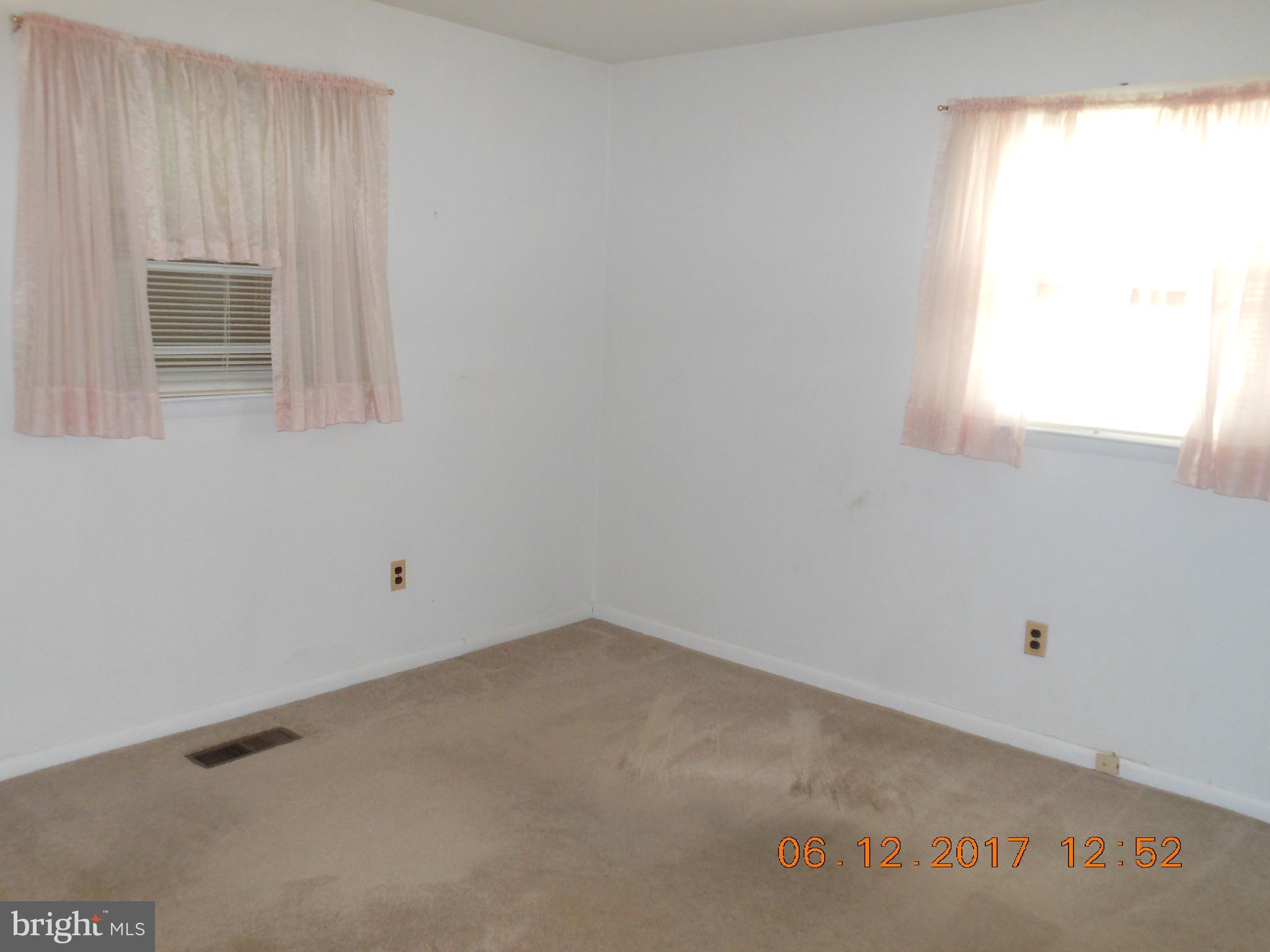3704 Holly Grove Road Baltimore, MD 21220 - Photo 8 of 13 an empty room with a window