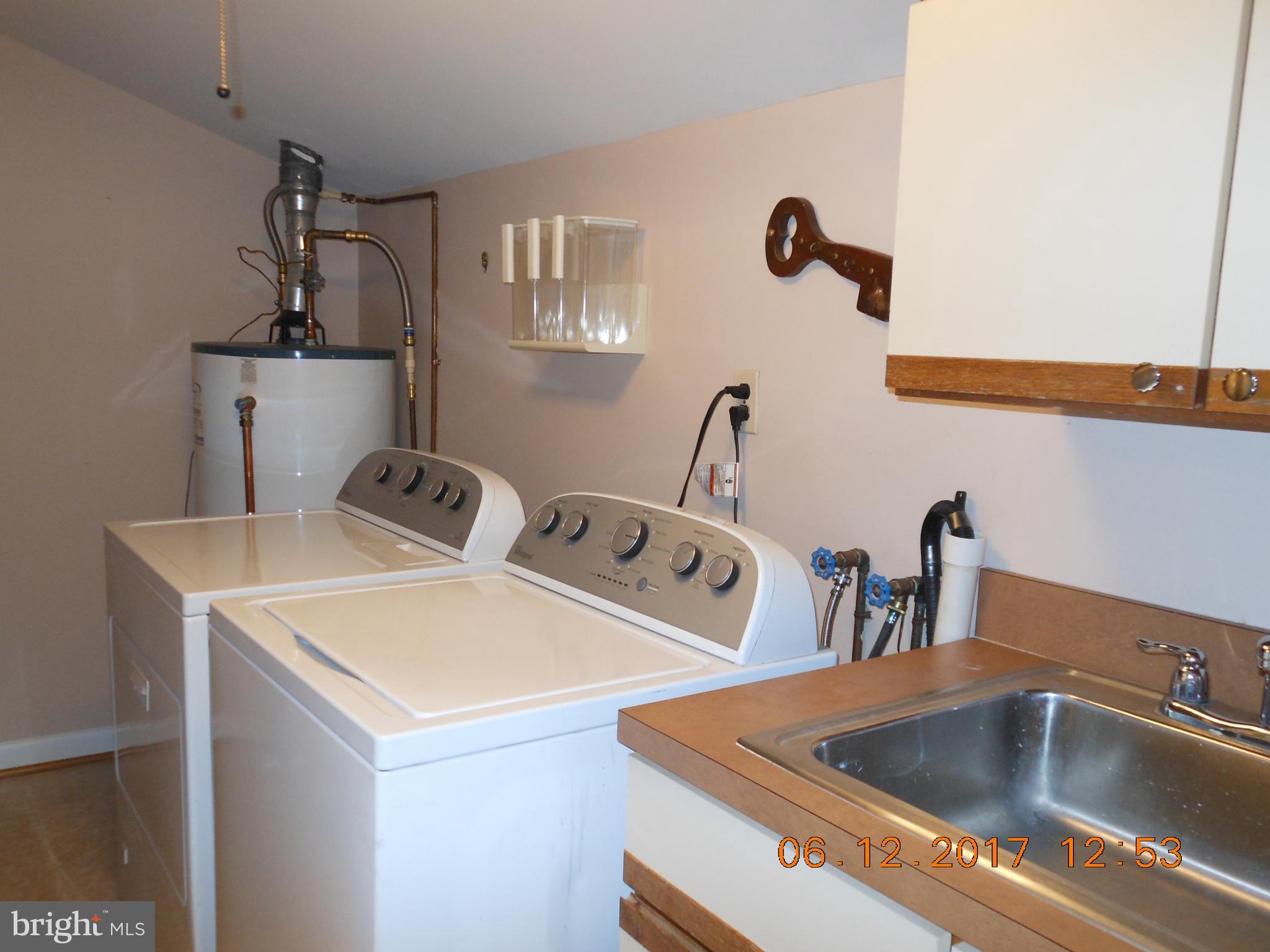 3704 Holly Grove Road Baltimore, MD 21220 - Photo 10 of 13 a close view of sink a faucet and chairs