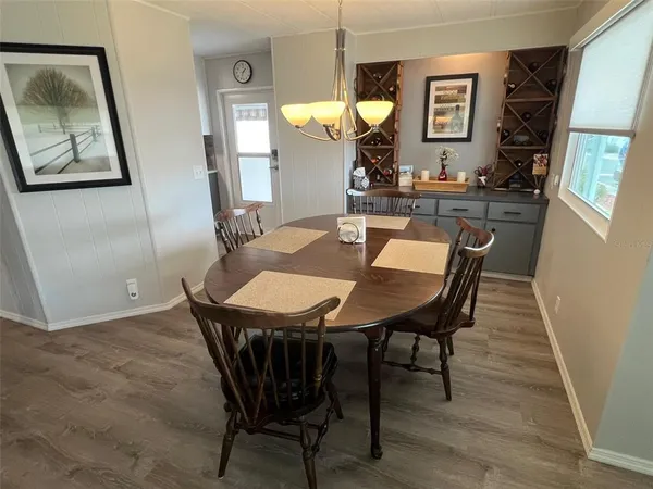 a kitchen with a sink cabinets and a window
