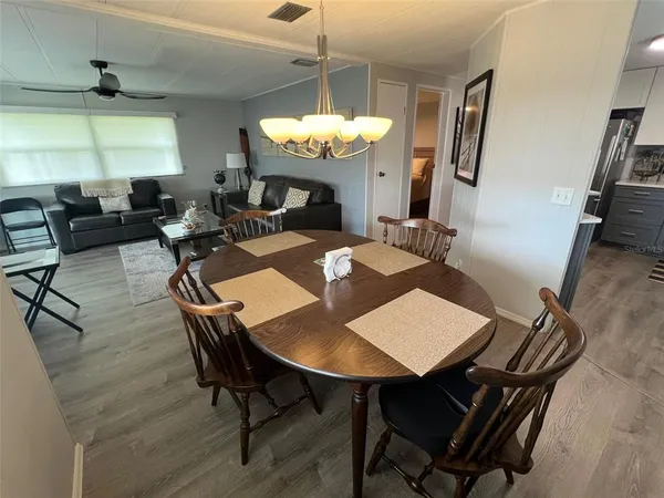 a view of a dining room with furniture and window