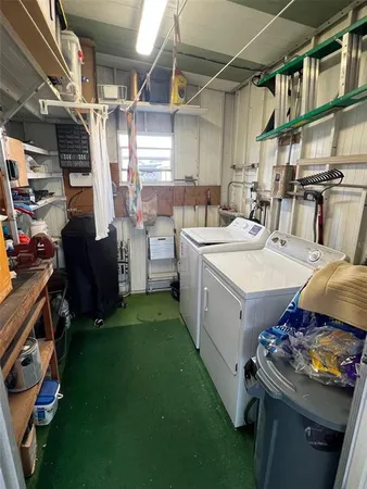a kitchen with a sink cabinets and window