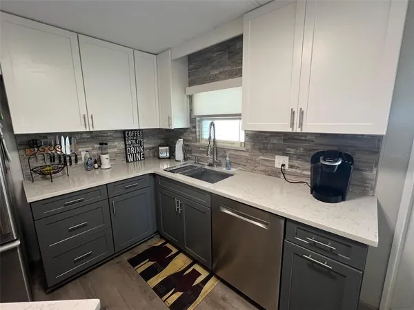 a kitchen with a refrigerator stove and microwave