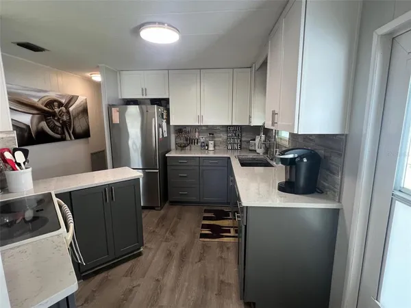 a view of a dining room with furniture and a potted plant