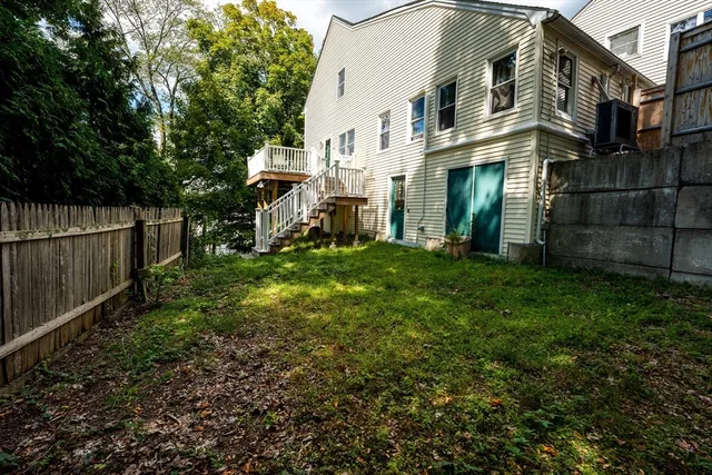 a view of a chairs and table on the roof deck