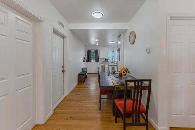 a view of a hallway with chairs