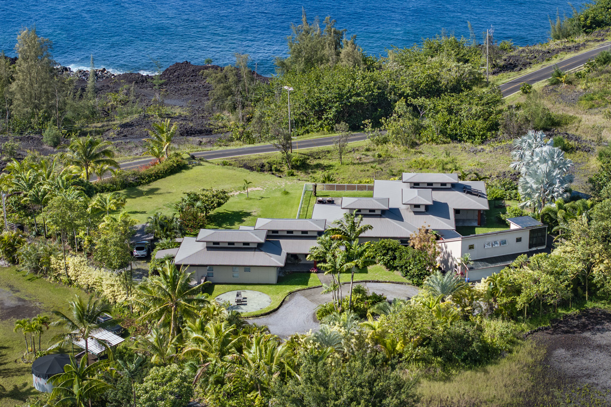 12-7124 Kalapana Kapoho Beach Road Pahoa, HI 96778 - Photo 1 of 30 an aerial view of a house with a yard