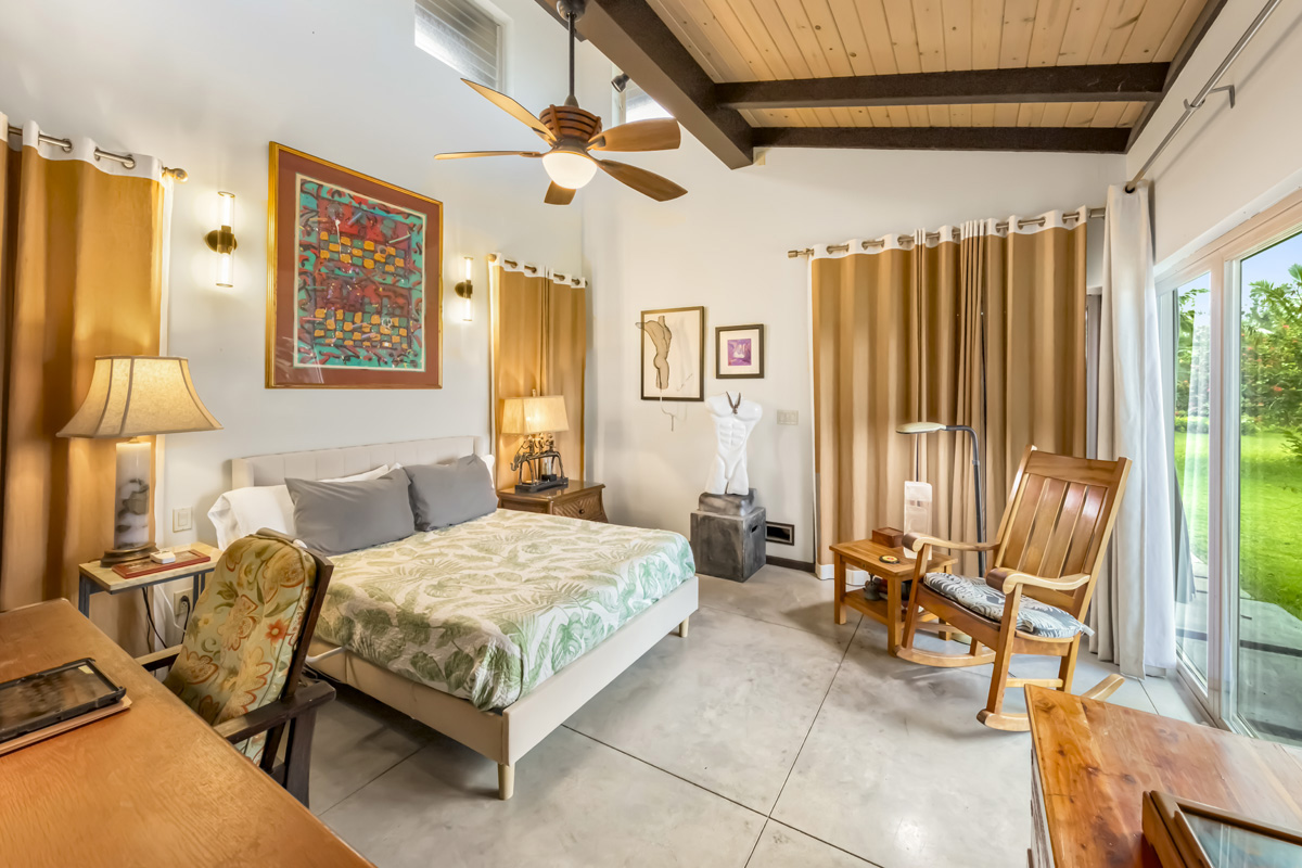 12-7124 Kalapana Kapoho Beach Road Pahoa, HI 96778 - Photo 13 of 30 a bedroom with a bed and a couch