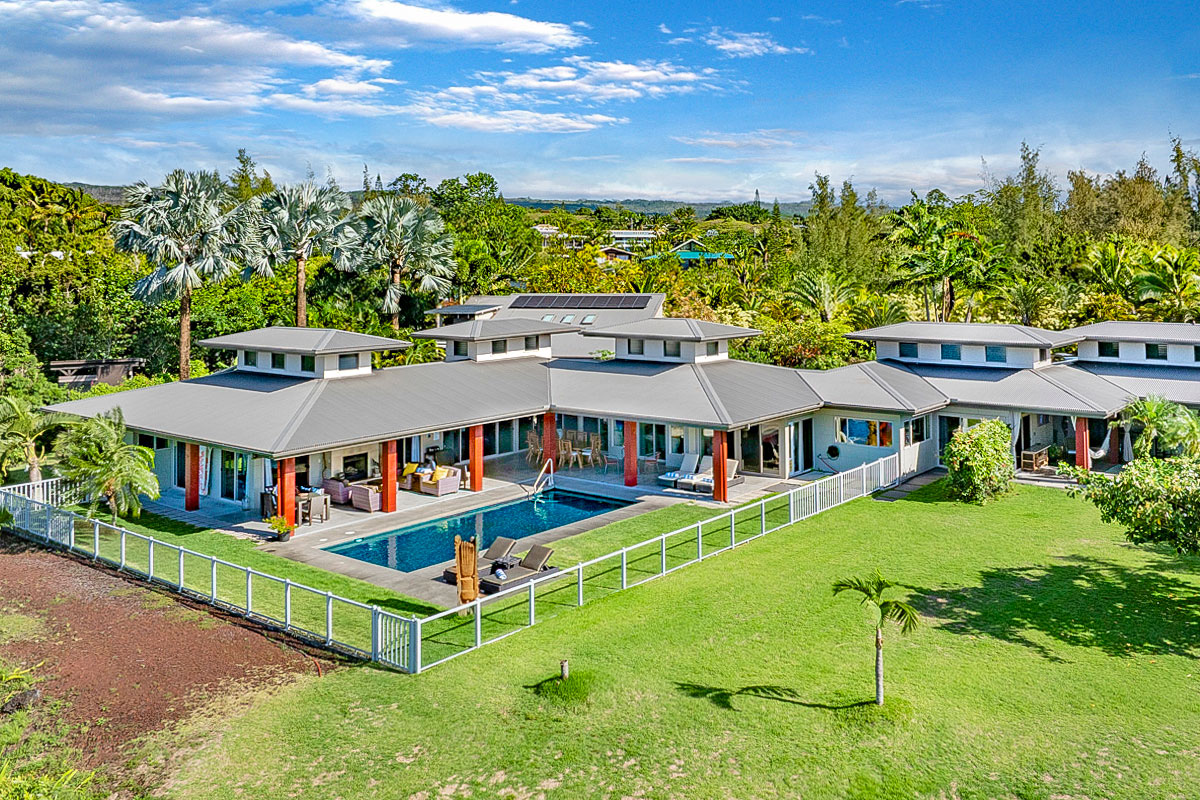 12-7124 Kalapana Kapoho Beach Road Pahoa, HI 96778 - Photo 2 of 30 an aerial view of a house with swimming pool garden view and trees