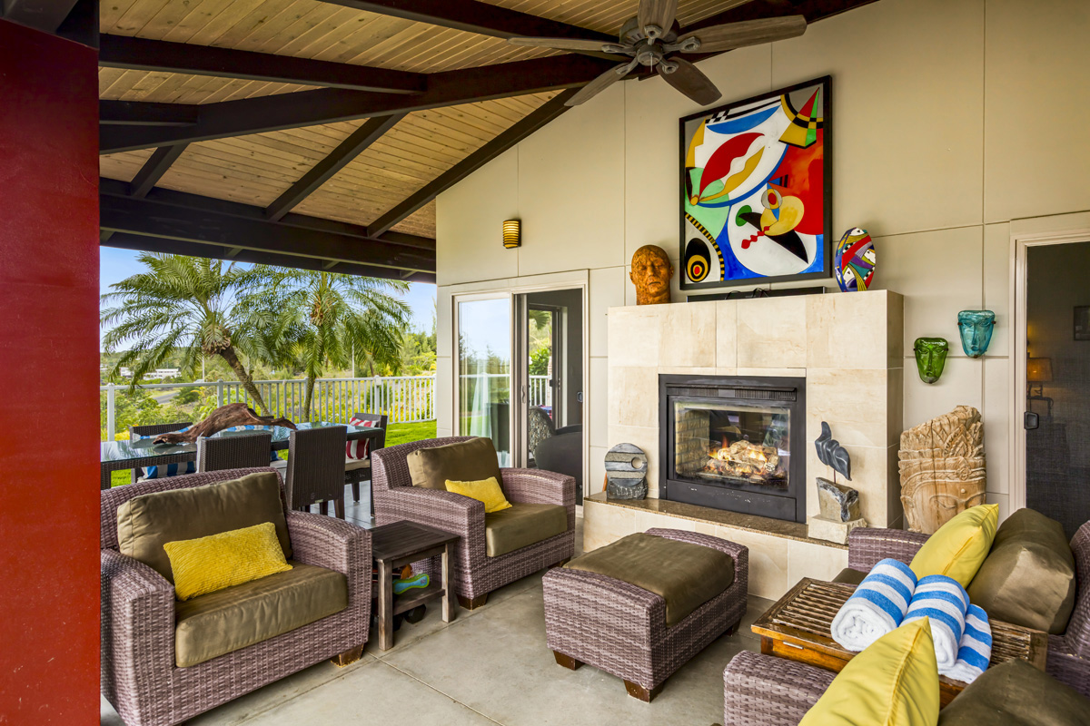 12-7124 Kalapana Kapoho Beach Road Pahoa, HI 96778 - Photo 4 of 30 a living room with furniture and a fireplace
