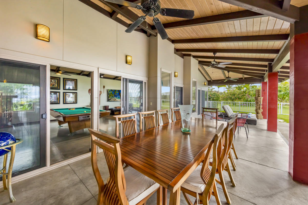 12-7124 Kalapana Kapoho Beach Road Pahoa, HI 96778 - Photo 5 of 30 a dining room with furniture and a floor to ceiling window