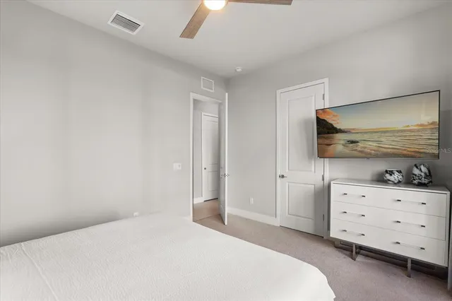 a bedroom with a bed and a dresser