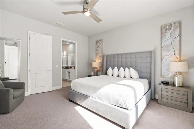 a bedroom with a large bed and furniture