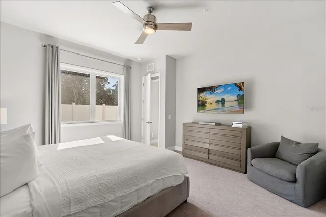 a bedroom with a bed and a dresser