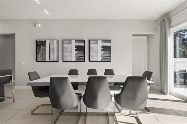 a view of a dining room with furniture and windows