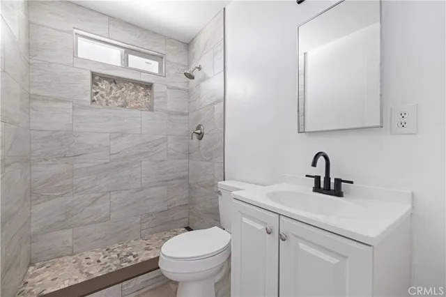 an empty room with a painting on the wall