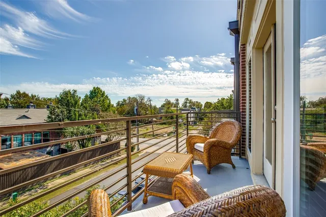 a living room with a bed furniture and a window