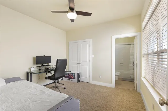 a bathroom with a double vanity sink mirror and bathtub