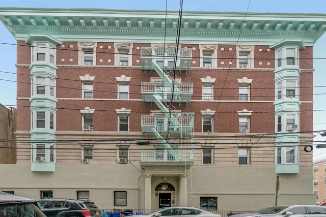 a front view of a building with glass windows