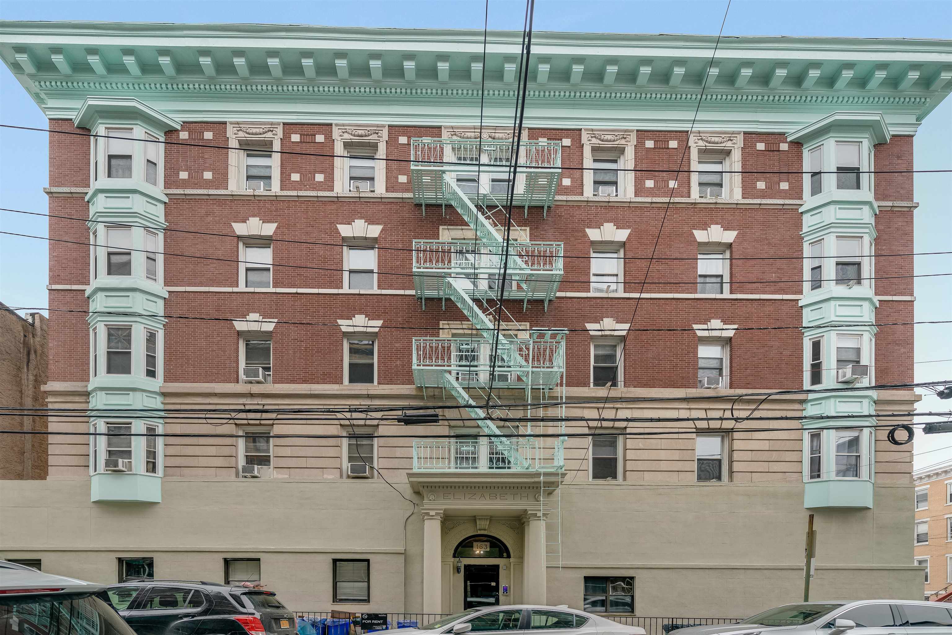 163 3rd Street, Unit 1A Hoboken, NJ 07030 - Photo 12 of 12 a front view of a building with glass windows