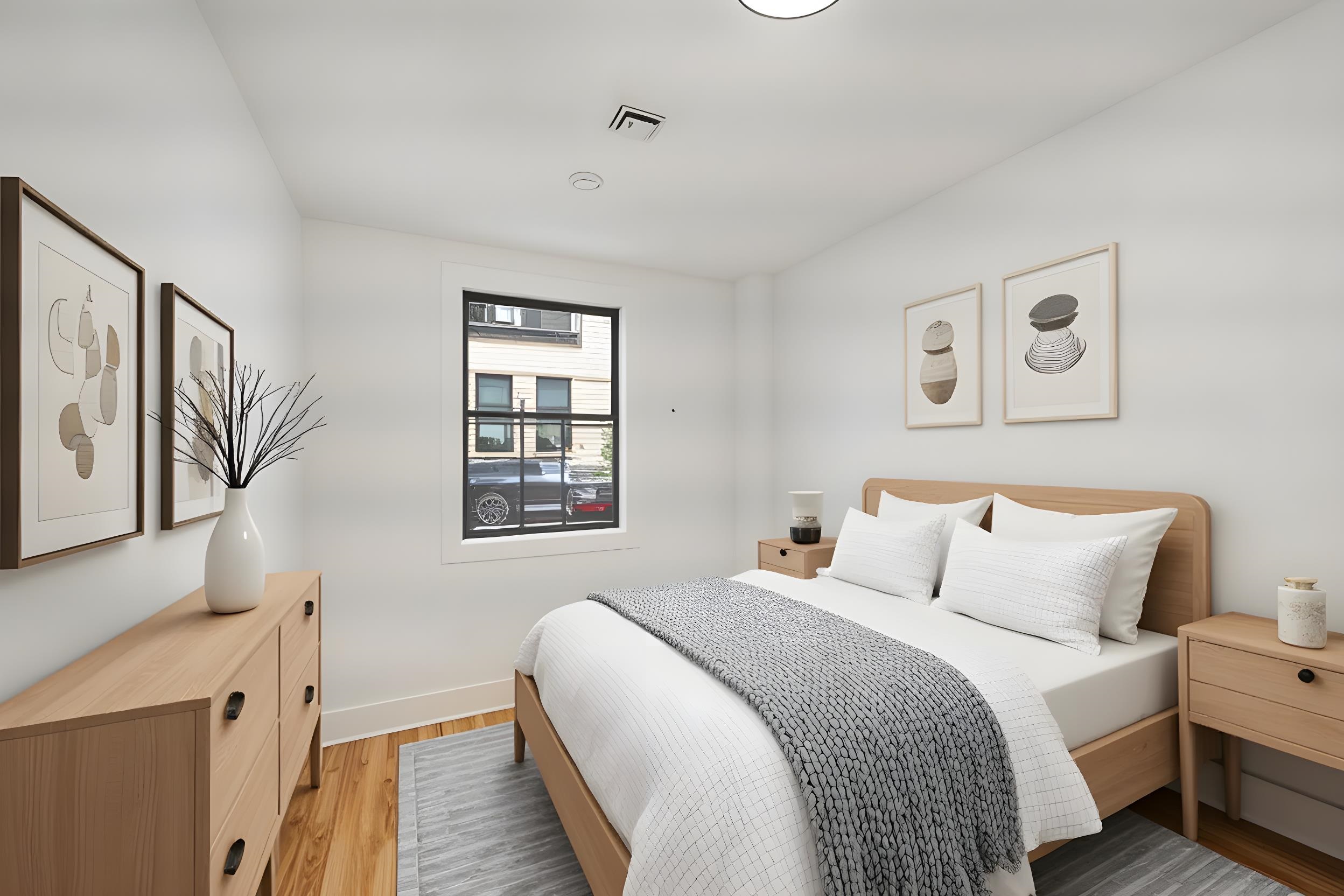 163 3rd Street, Unit 1A Hoboken, NJ 07030 - Photo 7 of 12 a bedroom with a bed and a window