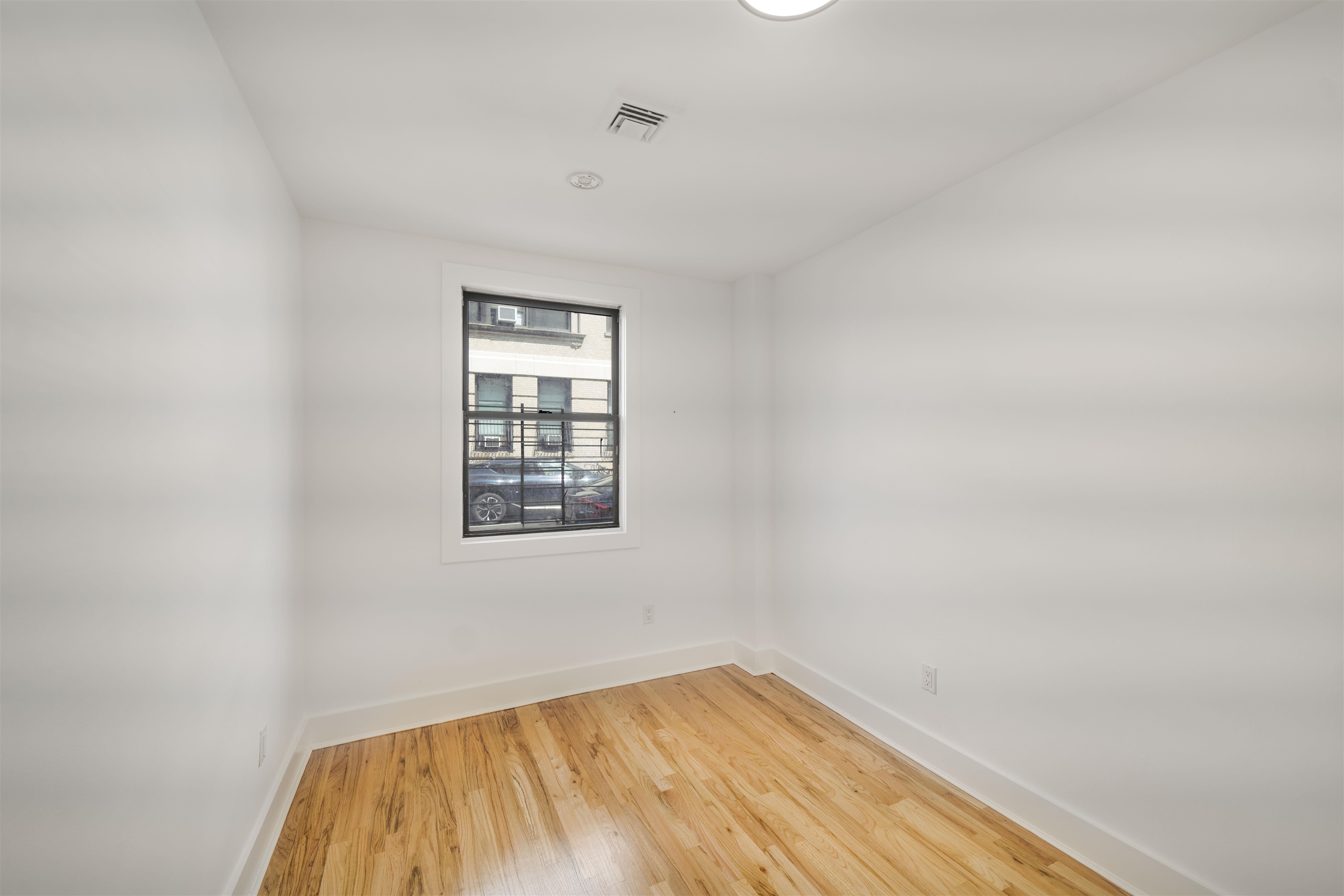 163 3rd Street, Unit 1A Hoboken, NJ 07030 - Photo 8 of 12 a view of a room that has a window in it