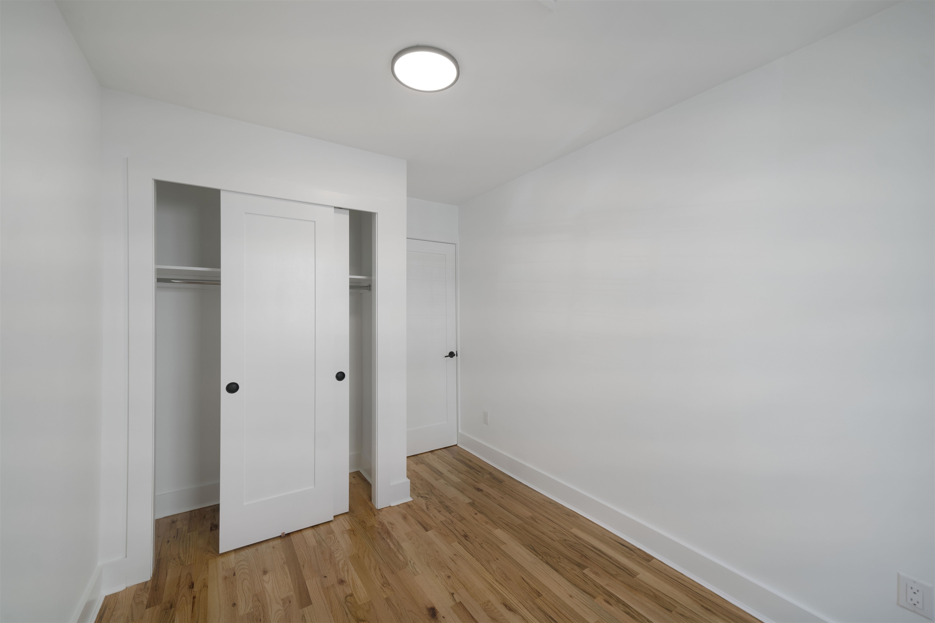 163 3rd Street, Unit 1A Hoboken, NJ 07030 - Photo 10 of 12 a view of hallway with closet and wooden floor