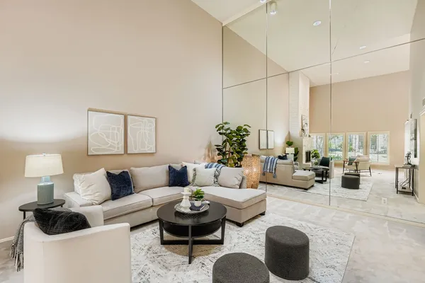 a living room with furniture and a lamp