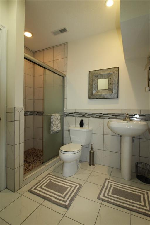 106 Rochelle Lane Monaca, PA 15061 - Photo 25 of 25 New full bath in lower level. Don't worry if you forget to shut off the lights. They are automatic on/off !