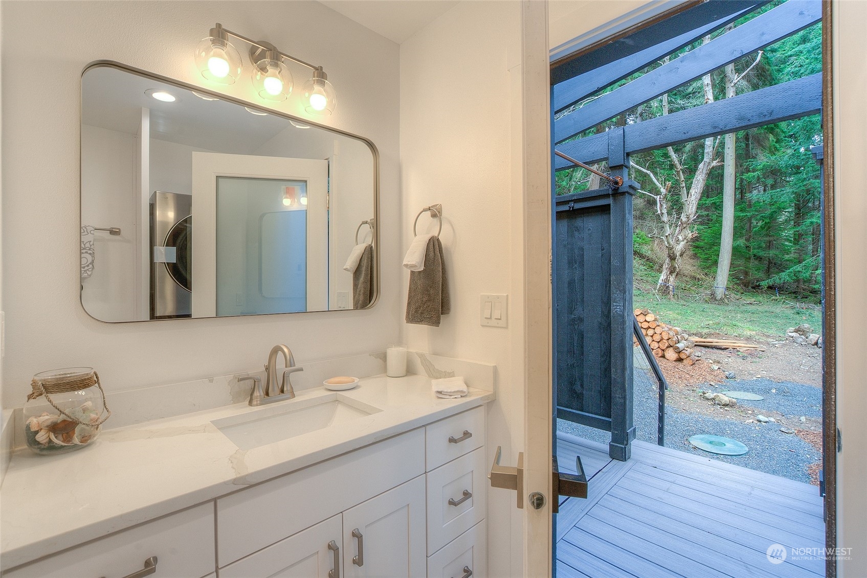 2567 Raccoon Point Road Orcas Island, WA 98245 - Photo 29 of 40 a en suite bathroom with a granite countertop sink and a mirror