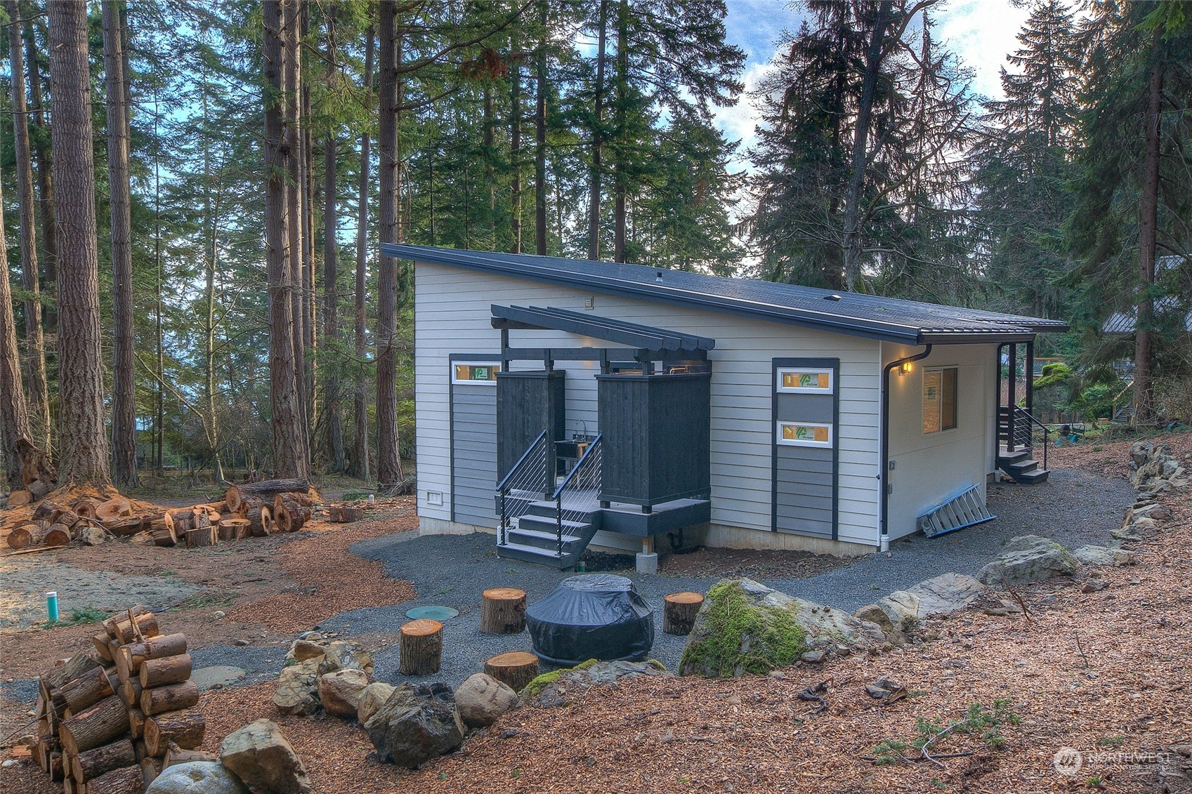 2567 Raccoon Point Road Orcas Island, WA 98245 - Photo 32 of 40 a backyard of a house with outdoor seating