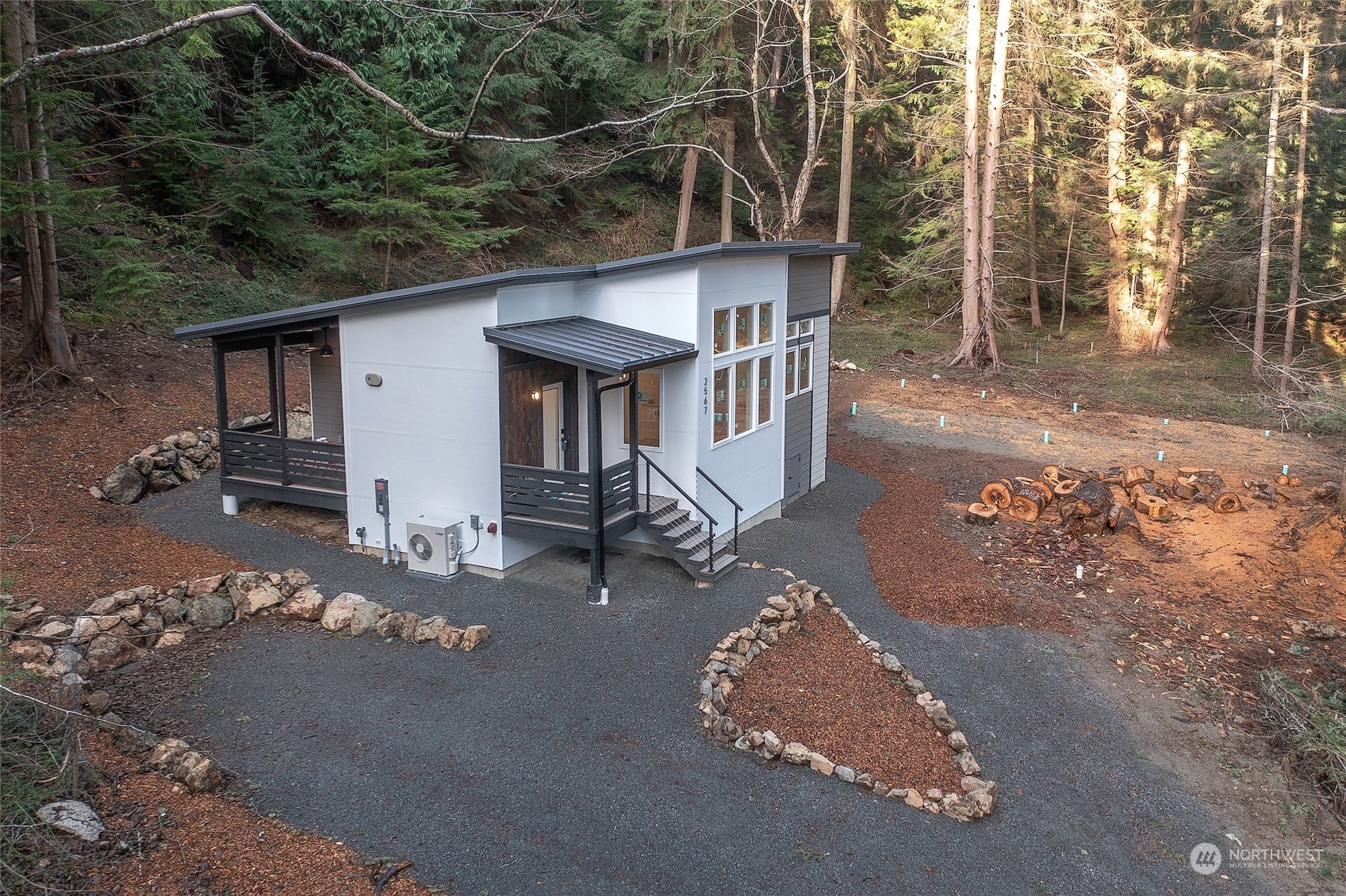 2567 Raccoon Point Road Orcas Island, WA 98245 - Photo 34 of 40 a view of a house with a yard
