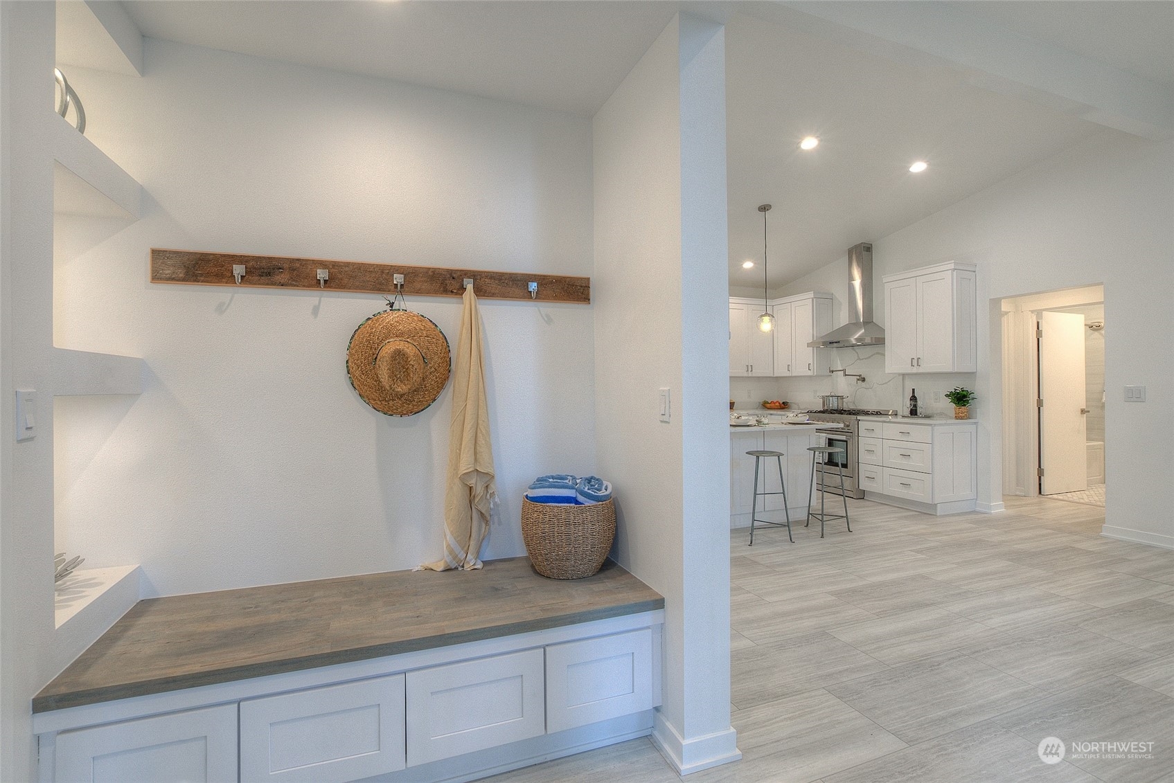 2567 Raccoon Point Road Orcas Island, WA 98245 - Photo 6 of 40 a view of a kitchen with kitchen island a stove and a wooden floors