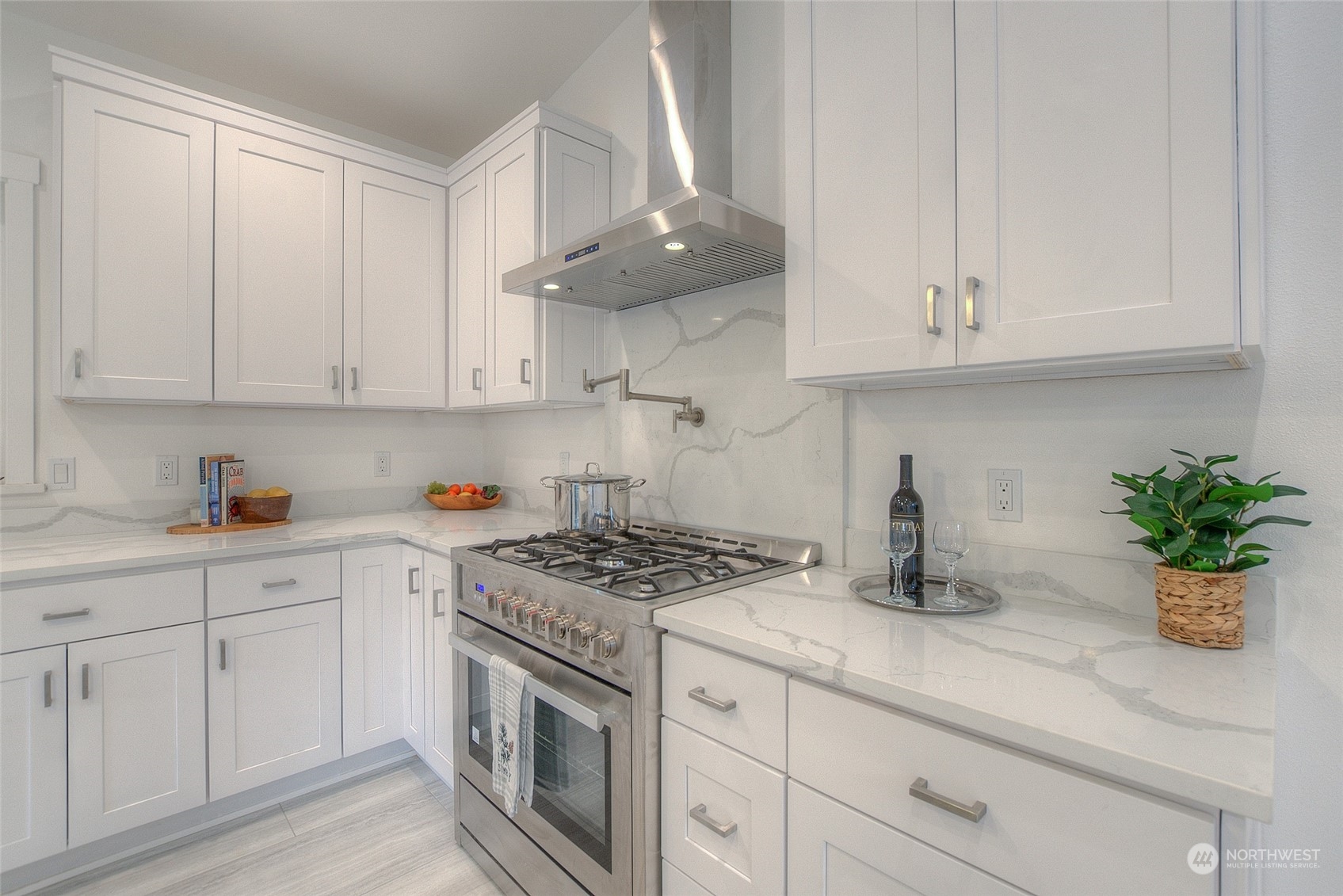 2567 Raccoon Point Road Orcas Island, WA 98245 - Photo 10 of 40 a kitchen with white cabinets and appliances