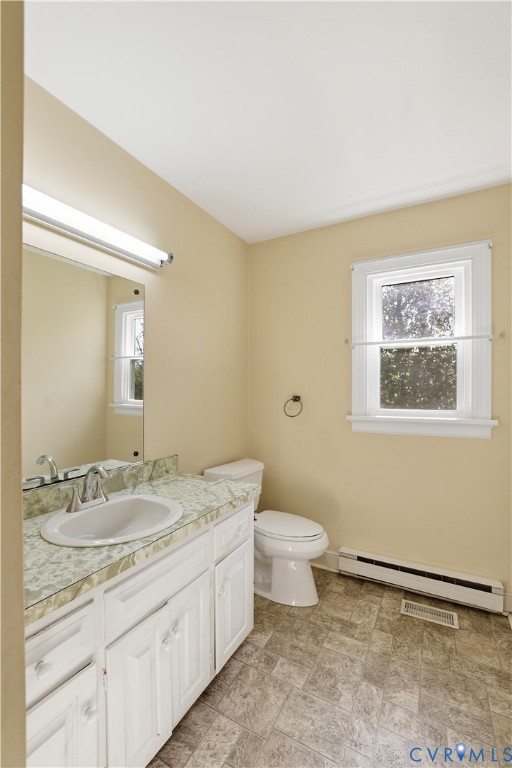 11352 Rockville Road Rockville, VA 23146 - Photo 22 of 38 a bathroom with a granite countertop sink mirror vanity and toilet