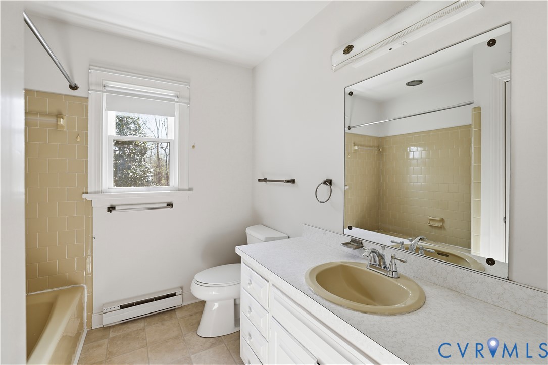 11352 Rockville Road Rockville, VA 23146 - Photo 26 of 38 a bathroom with a granite countertop sink toilet and mirror