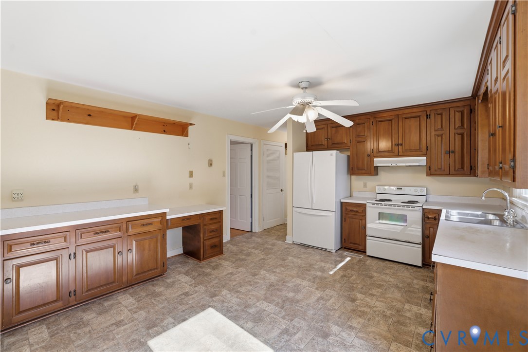 11352 Rockville Road Rockville, VA 23146 - Photo 10 of 38 a kitchen with a stove sink and cabinets
