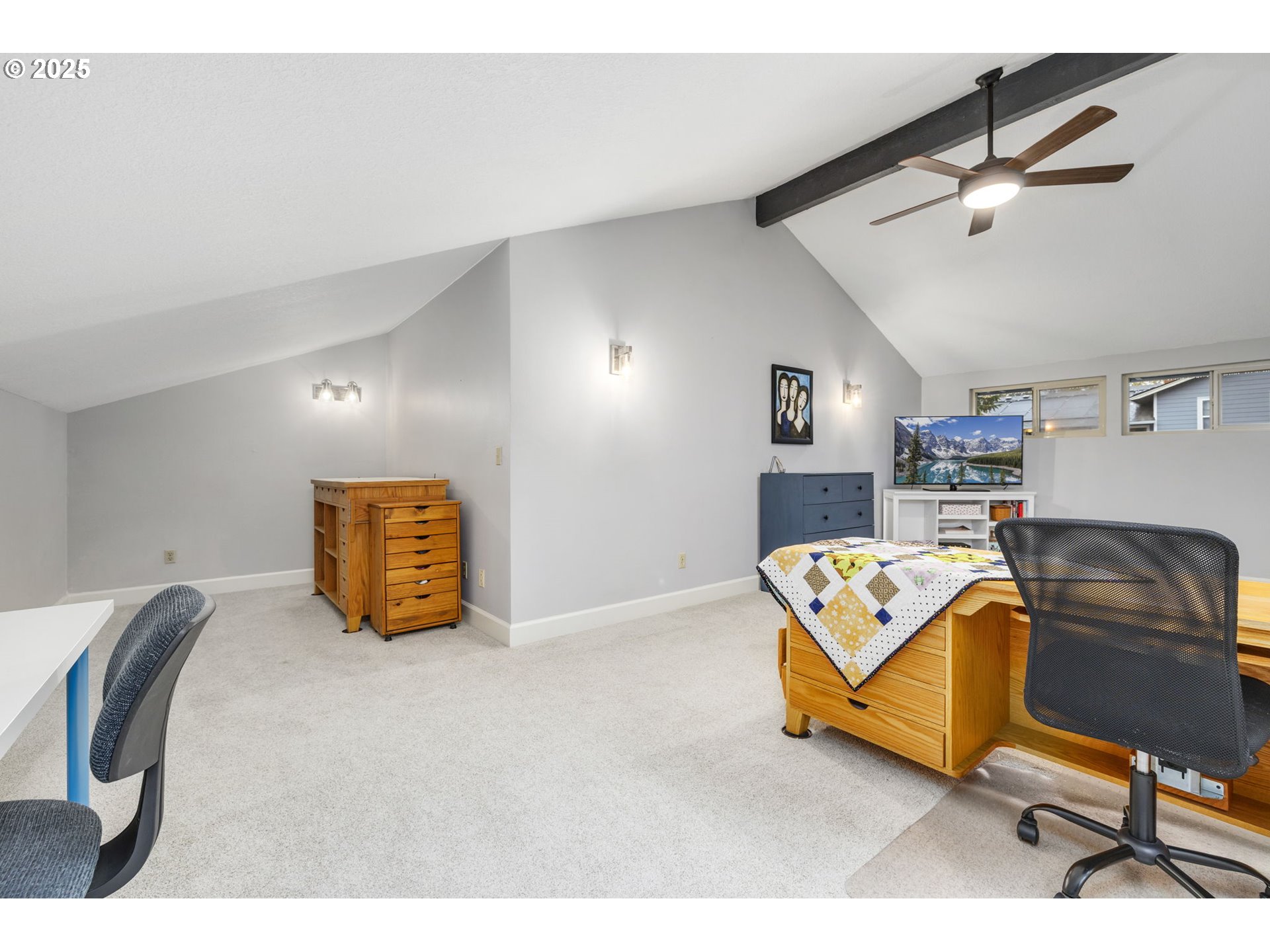 19895 Northwest Nestucca Drive Portland, OR 97229 - Photo 11 of 33 a bedroom with a bed and a chair