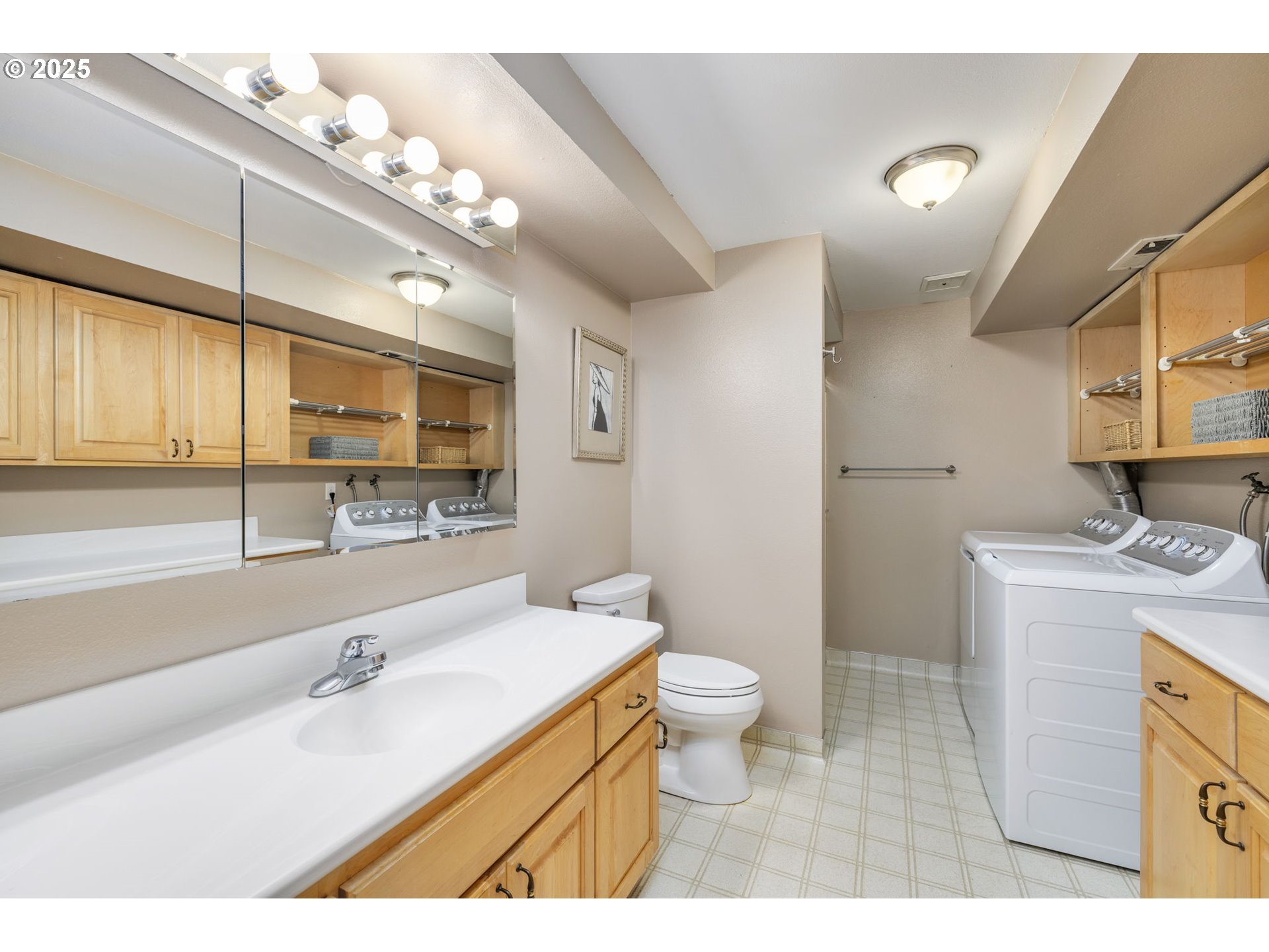 19895 Northwest Nestucca Drive Portland, OR 97229 - Photo 21 of 33 a bathroom with a sink a toilet and a mirror