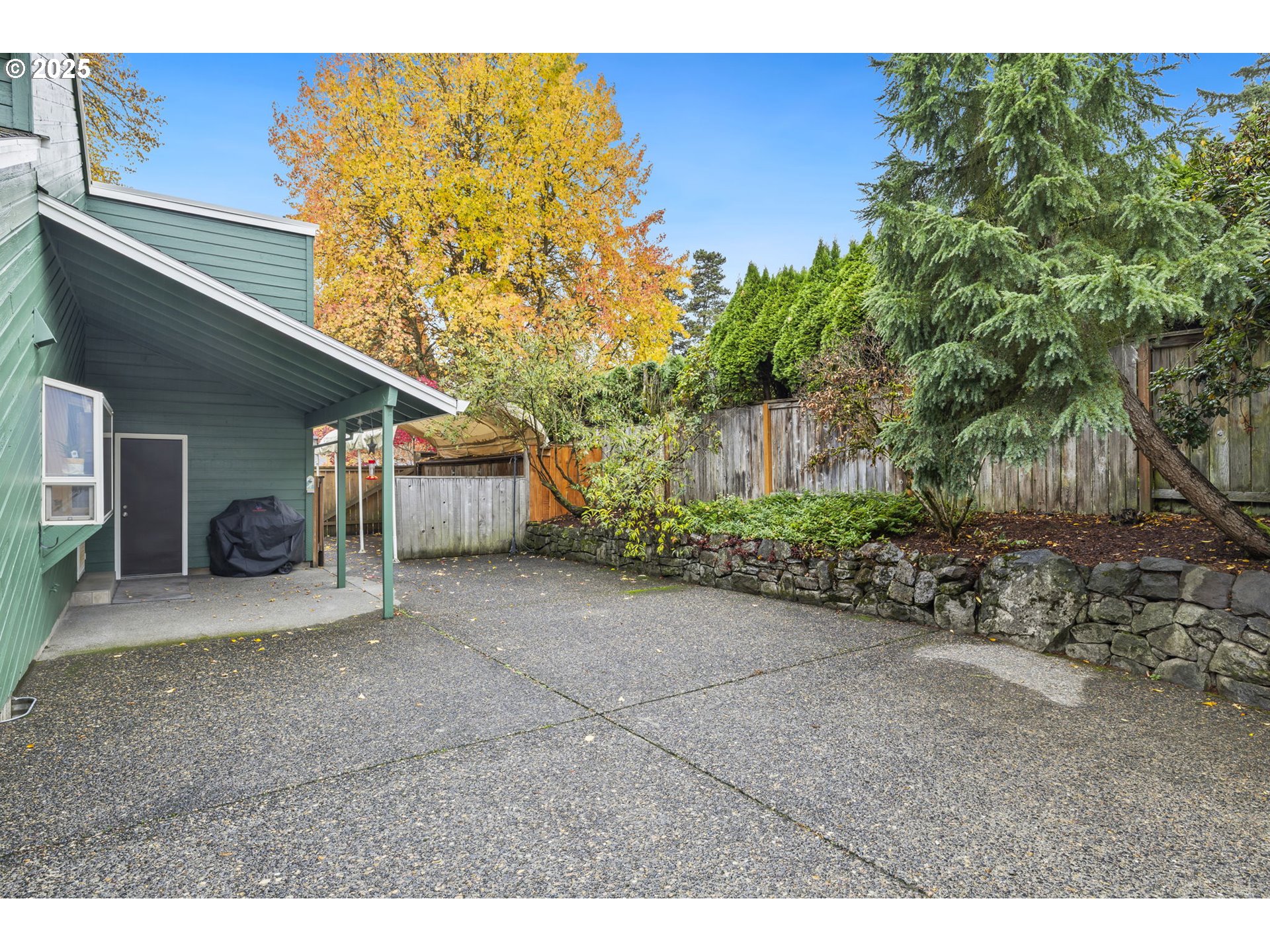 19895 Northwest Nestucca Drive Portland, OR 97229 - Photo 27 of 33 a view of a house with a backyard