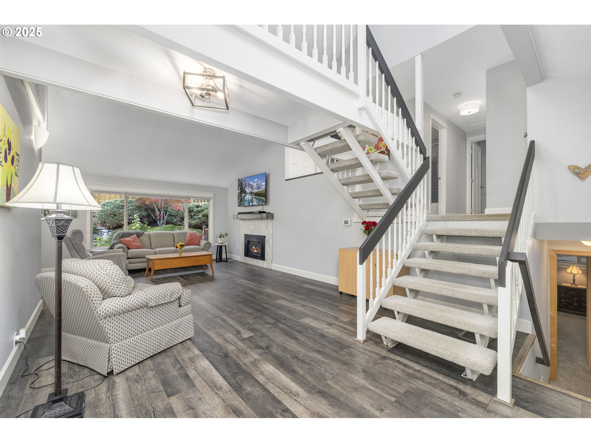 19895 Northwest Nestucca Drive Portland, OR 97229 - Photo 3 of 33 a living room with furniture and a wooden floor