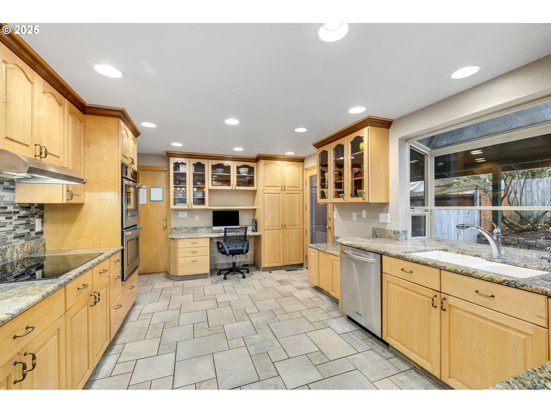 19895 Northwest Nestucca Drive Portland, OR 97229 - Photo 7 of 33 a open kitchen with stainless steel appliances granite countertop a refrigerator and a stove top oven