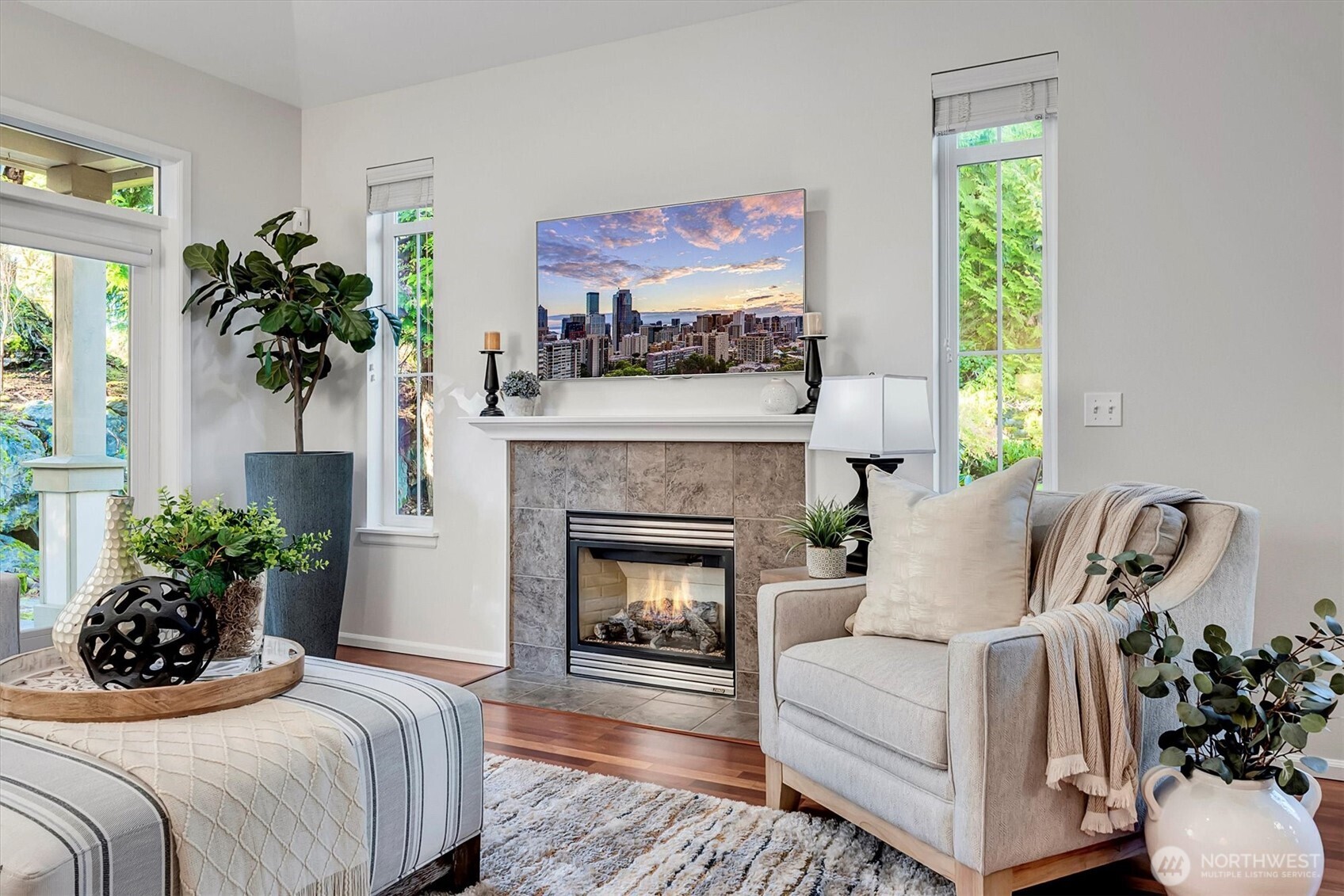 23857 Northeast 112th Circle, Unit 2 Redmond, WA 98053 - Photo 14 of 28 a bedroom with a bed and a fireplace