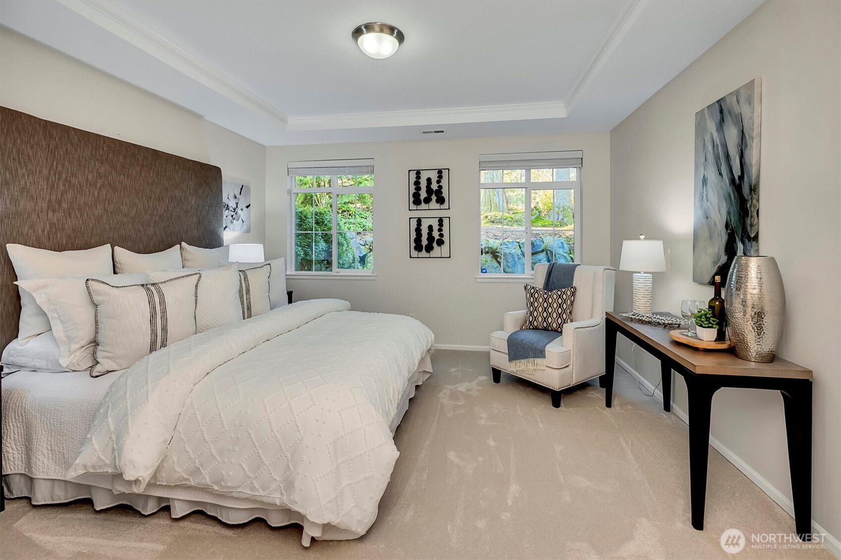 23857 Northeast 112th Circle, Unit 2 Redmond, WA 98053 - Photo 15 of 28 a spacious bedroom with a bed and a couch