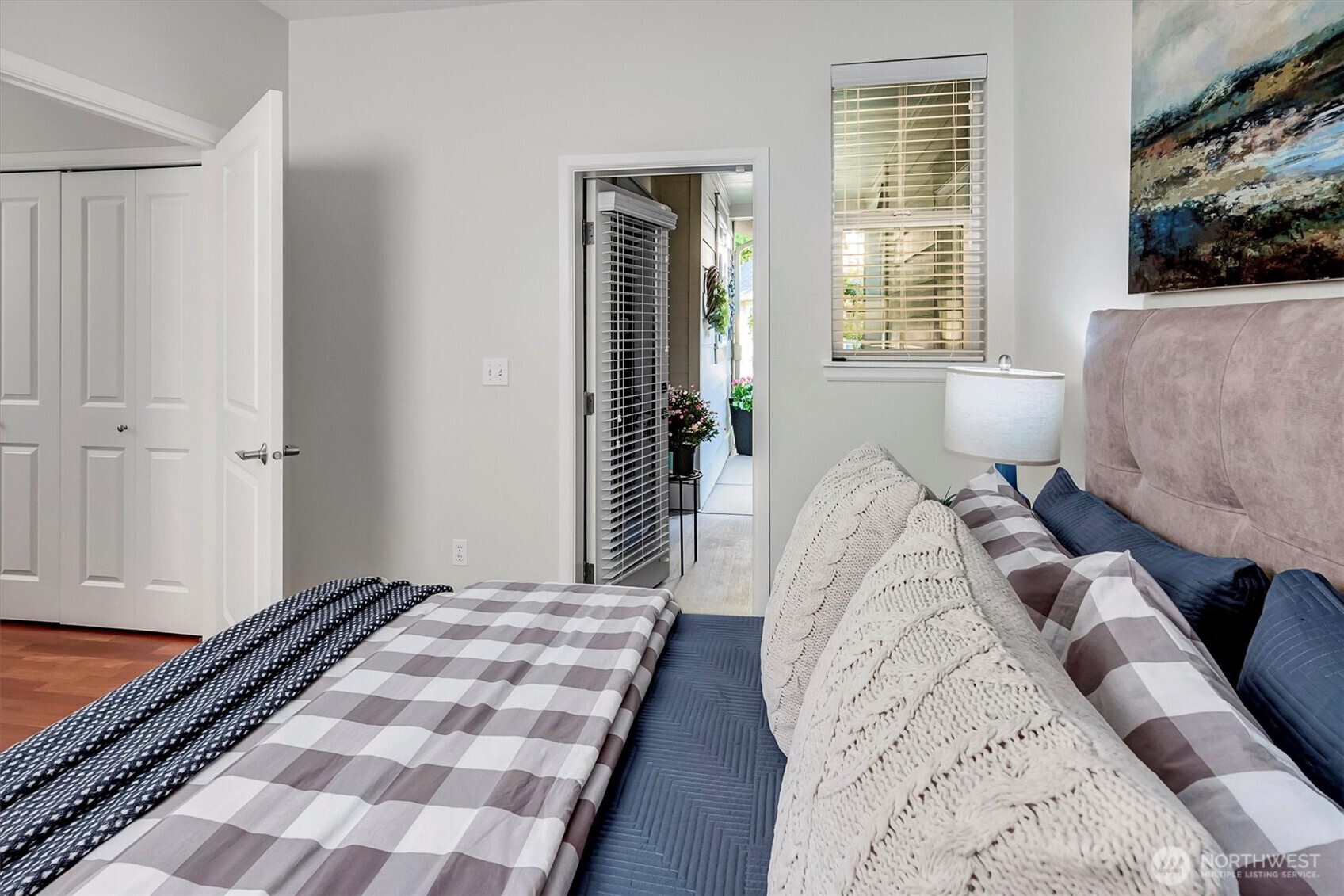 23857 Northeast 112th Circle, Unit 2 Redmond, WA 98053 - Photo 20 of 28 a bed sitting in a bedroom next to a window