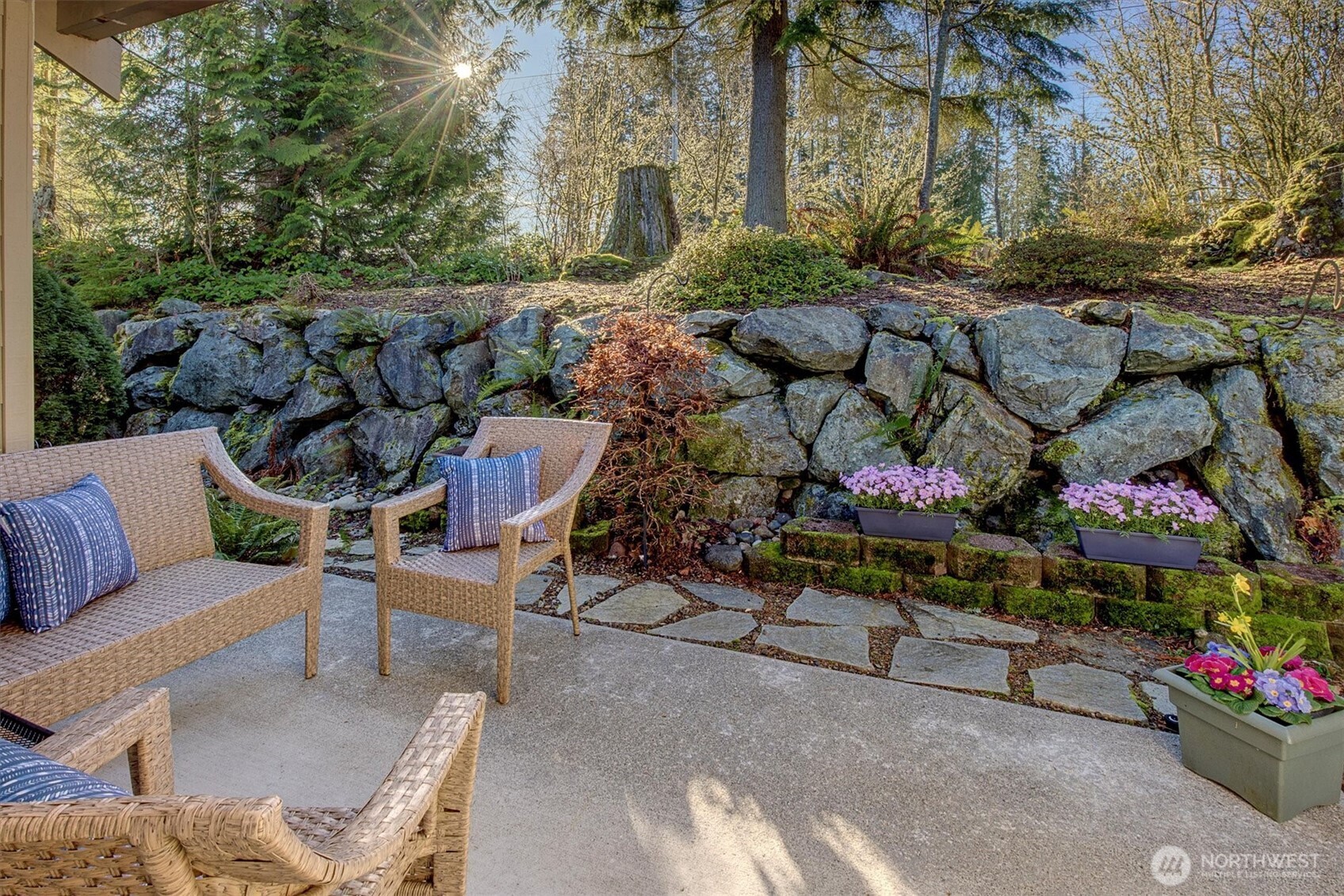 23857 Northeast 112th Circle, Unit 2 Redmond, WA 98053 - Photo 23 of 28 a view of backyard with outdoor seating and flowers